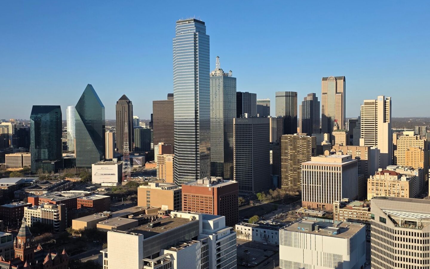 Downtown Dallas skyline under a clear blue sky